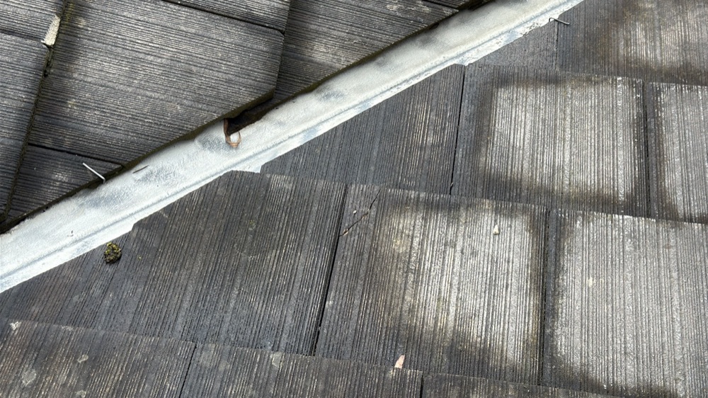 Cracked and broken roof tiles letting water into the roof space, found during a defect investigation in Mernda, 20 km from Mickleham