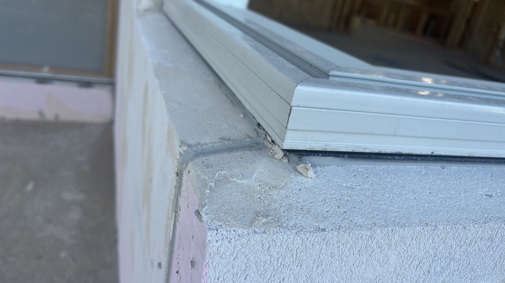 Window rubber flashings not seated between window and cladding, found during a lock-up inspection in Mickleham