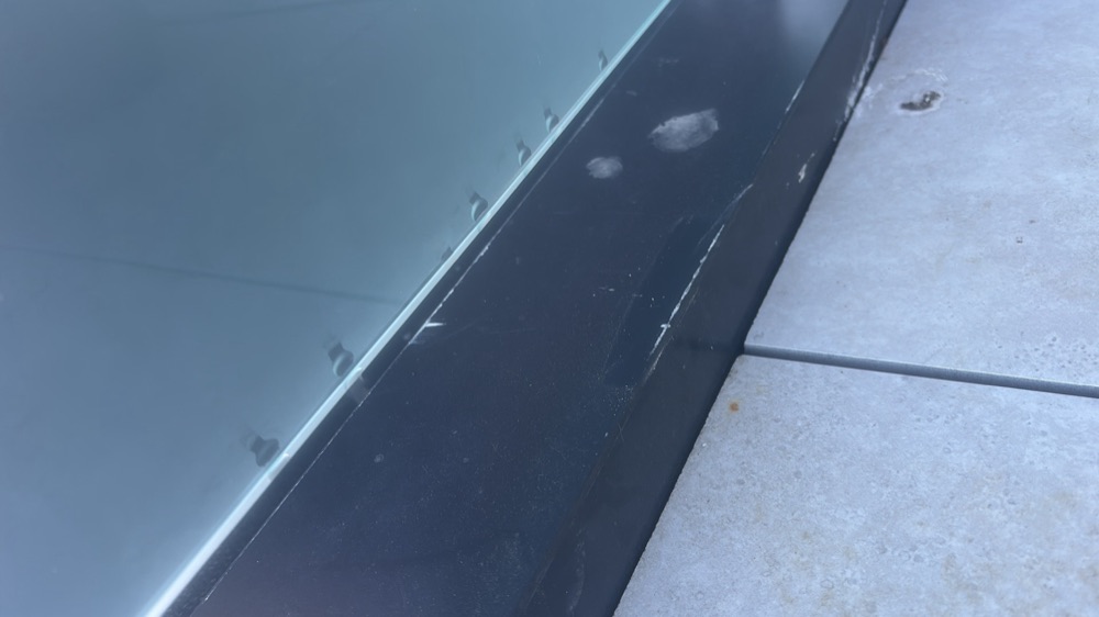 Metal roof damaged, scratched or dented in several areas, found during a pre-handover inspection in Mickleham