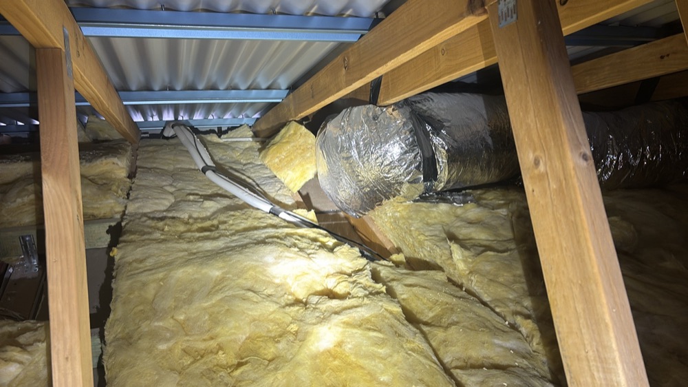 Ducting tightly bent or crimped, restricting airflow, found during a pre-handover inspection in Mickleham