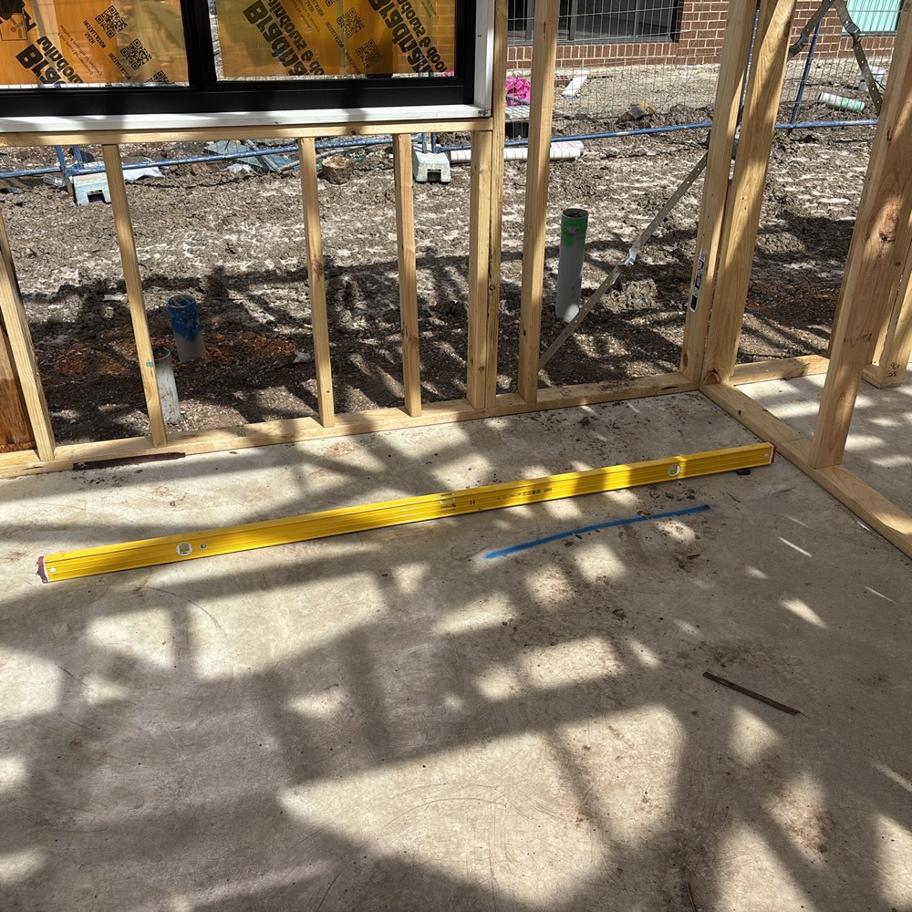 Slab deviating from level by more than the tolerance allows, found during a frame inspection in Mickleham