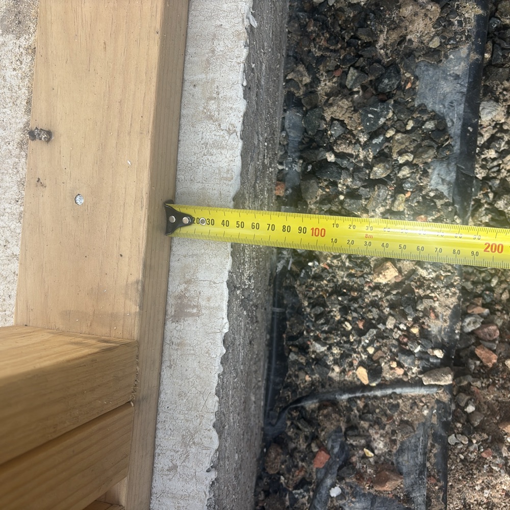 Slab extending beyond the timber frame by over 20mm, found during a frame inspection in Mickleham