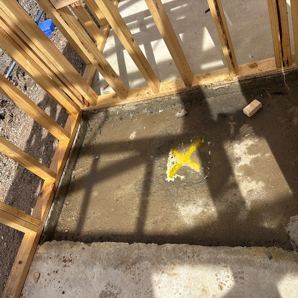 Shower concrete recess extending more than 10mm beyond the frame, found during a waterproofing inspection in Mickleham